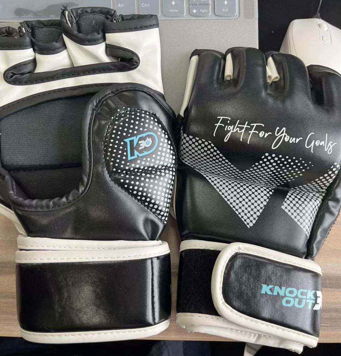 UFC-style 4oz competition MMA gloves with minimal knuckle padding and enclosed thumb
